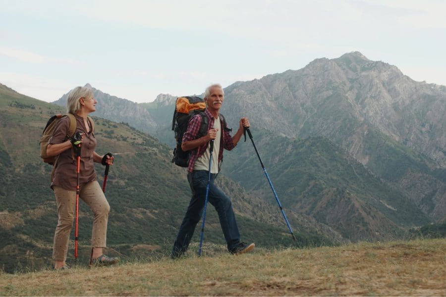 A retired couple hiking.