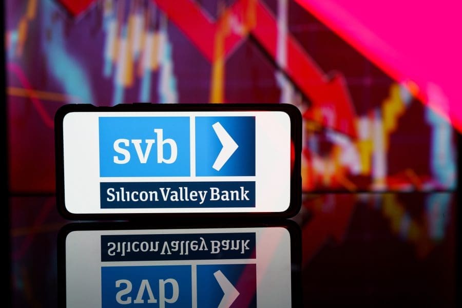 a phone showing an image of the Silicon Valley Bank logo