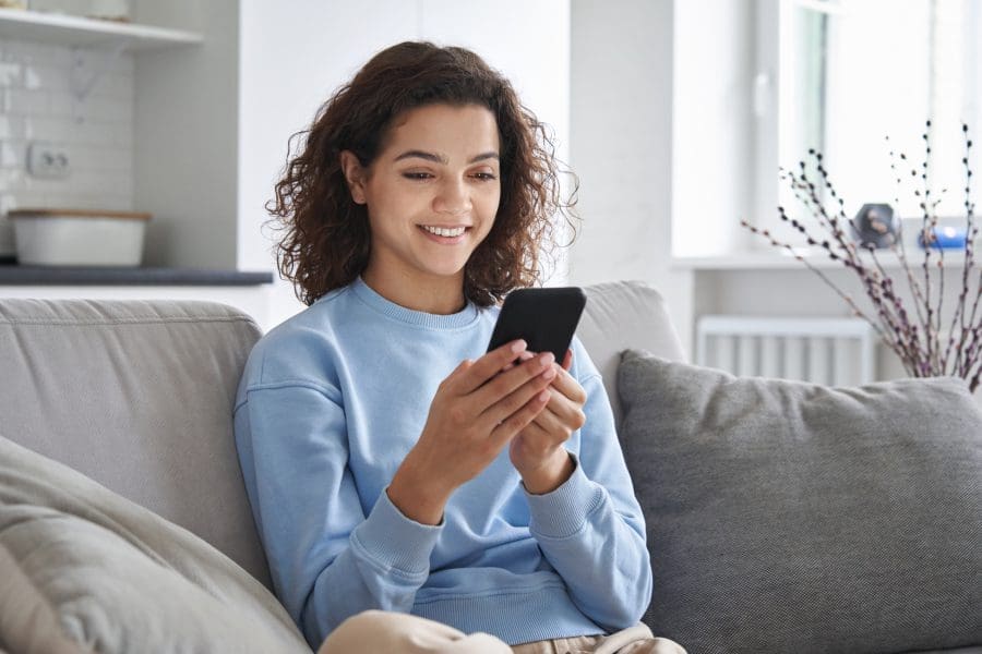 A young woman using her phone.