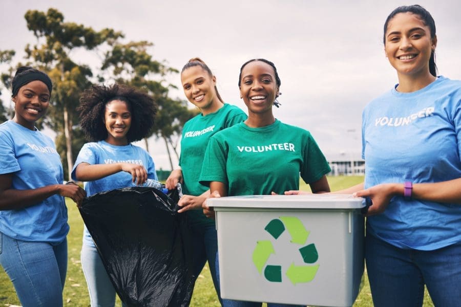 A group of women volunteering outside.