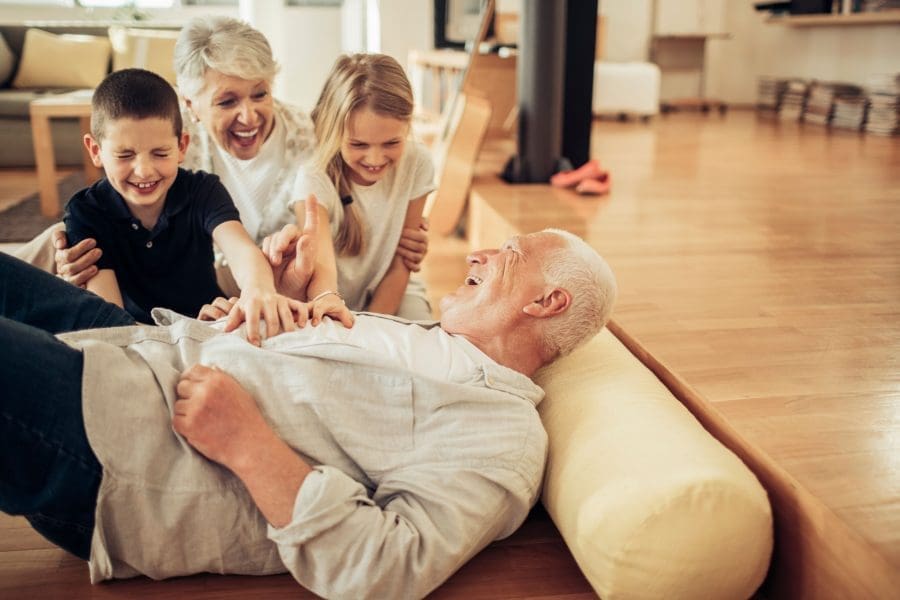 Grandparents playing with their grandchildren.