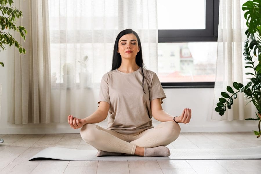 A woman meditating.