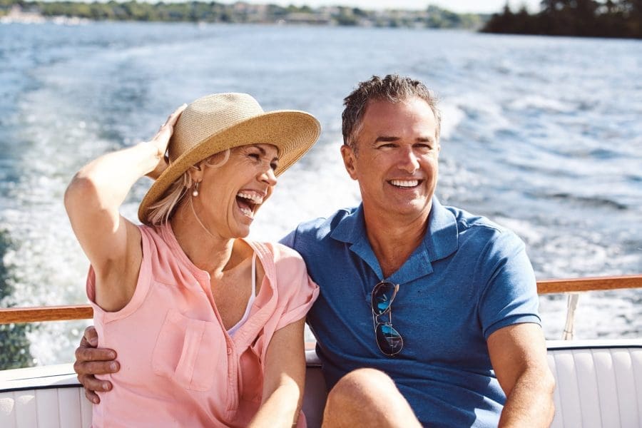 A couple on a yacht cruise.