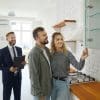 A couple viewing a property with an estate agent.