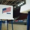 A voting booth with an American flag.