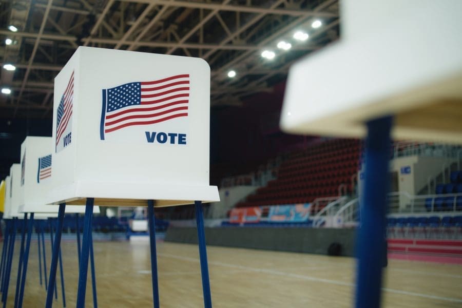 A voting booth with an American flag.